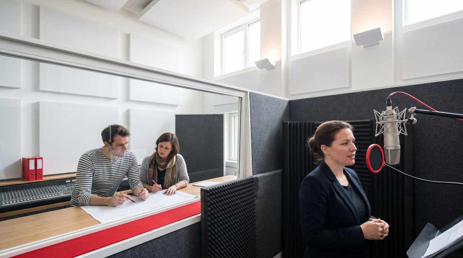 Multimedia Localization Partner buyer guide: MoniSa multimedia specialists preparing voice and localization work in a studio.